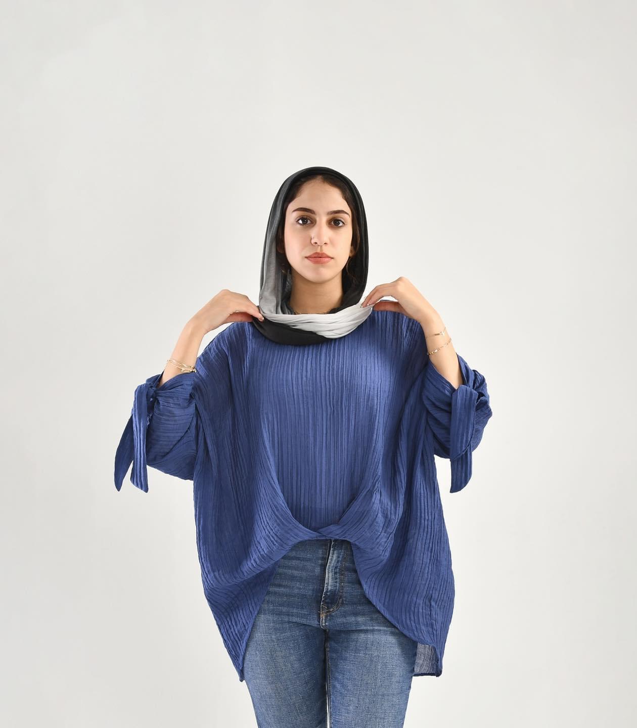 knotted blouse in blue jeans