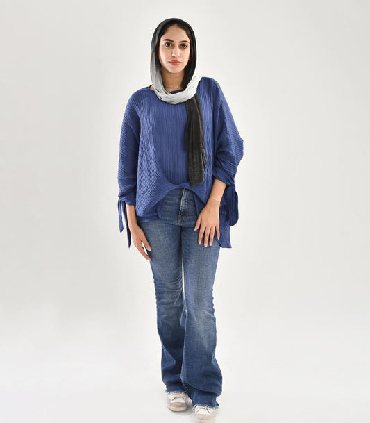 knotted blouse in blue jeans