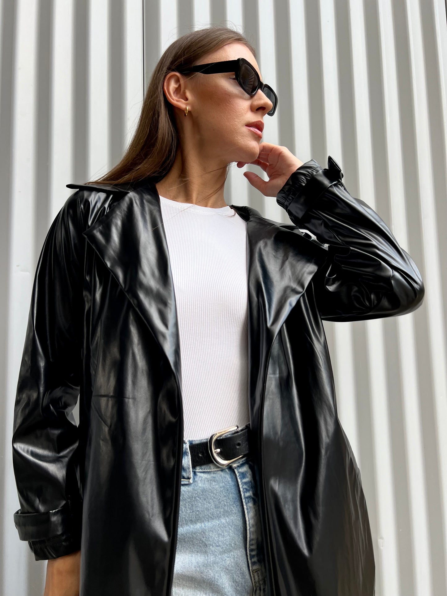 Belted leather coat in black