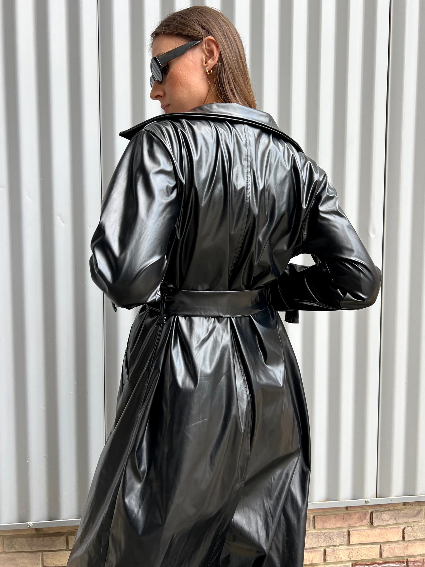 Belted leather coat in black