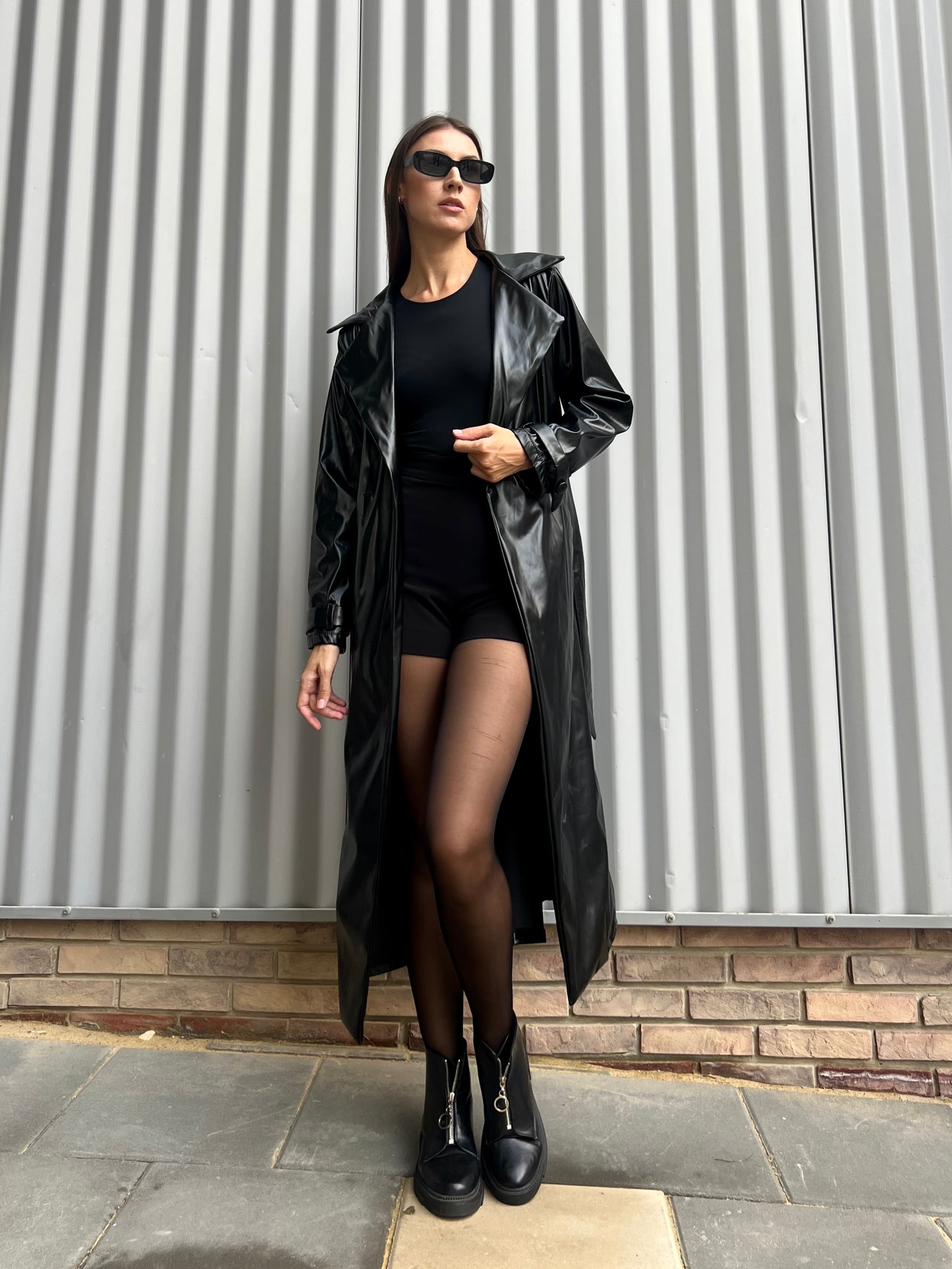 Belted leather coat in black