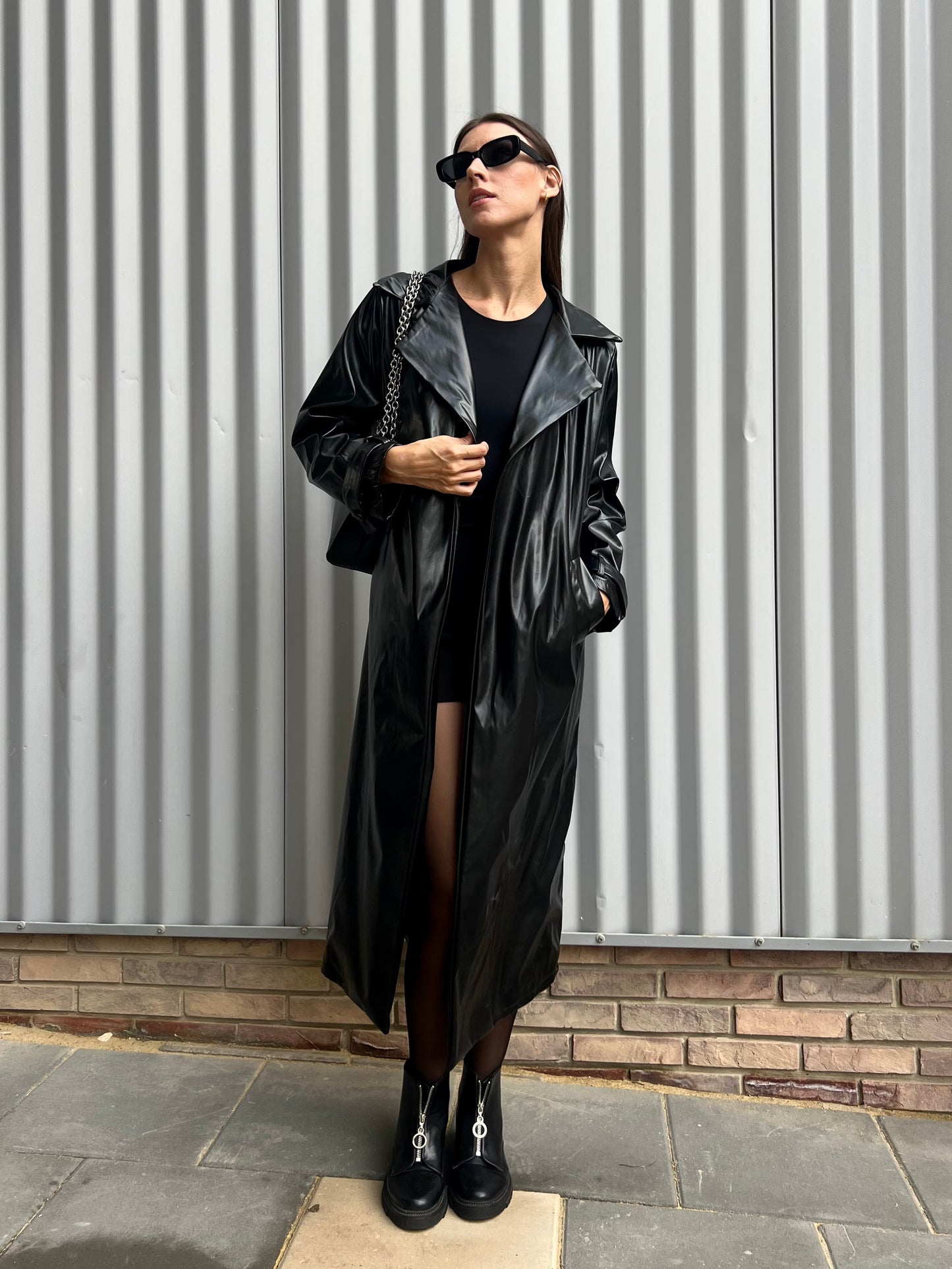 Belted leather coat in black